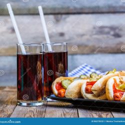 A vendor sells hot dogs and s sodas